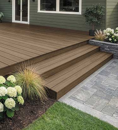 Close up of deck and stairs showing 2026 Color of the Year Acorn Cabot® Stain