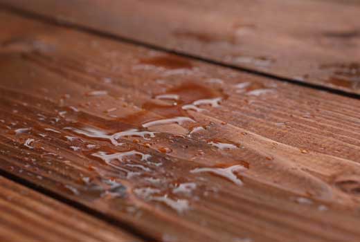 water beading on a deck