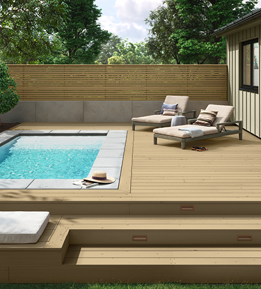deck with a pool and chairs