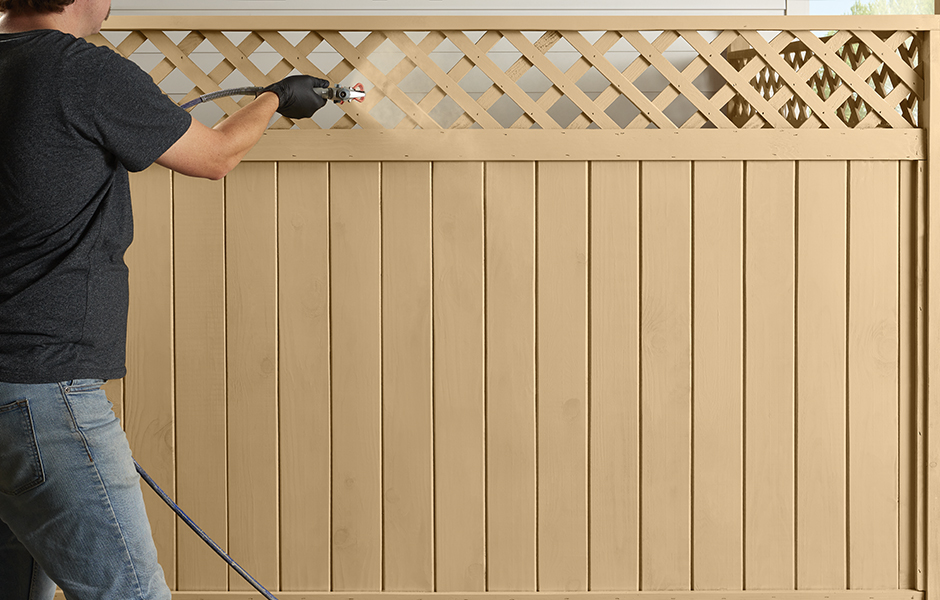 Cabot 2022 Lifestyle and Application Imagery,Fence 3 application of Semi-Transparent stain in Acorn, RGB image for digital use